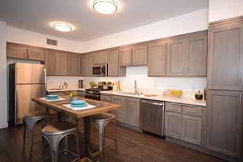 Yolo apartments kitchen with appliances and activity hub